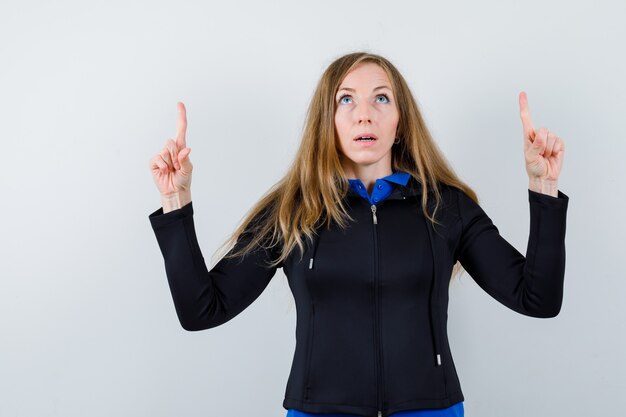 Expressive young woman posing in the studio