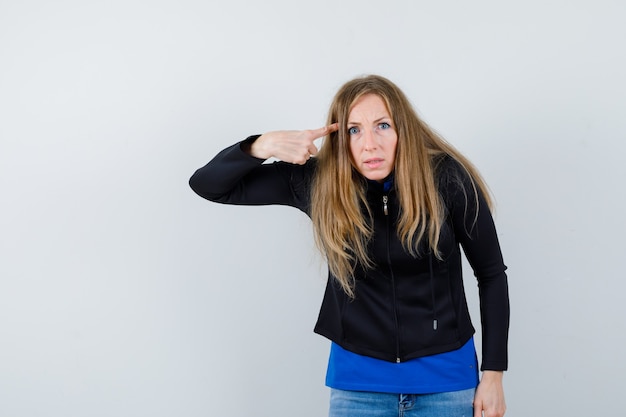 Expressive young woman posing in the studio