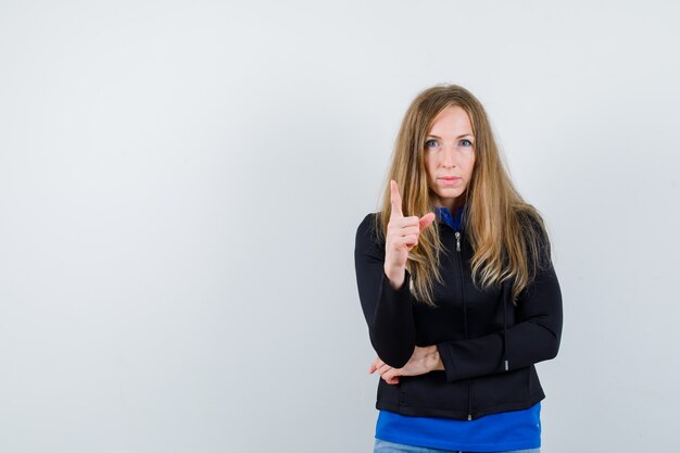 Expressive young woman posing in the studio