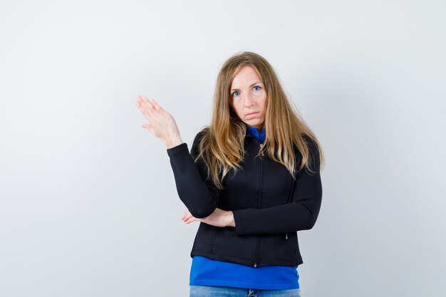 Expressive young woman posing in the studio