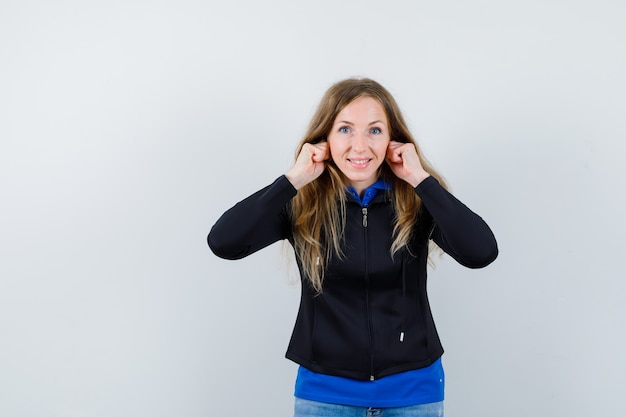 Expressive young woman posing in the studio