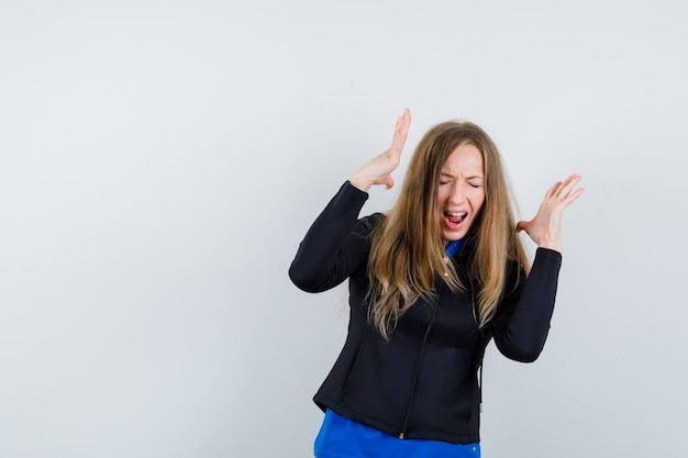 Expressive young woman posing in the studio