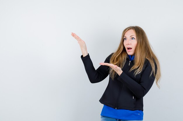 Expressive young woman posing in the studio