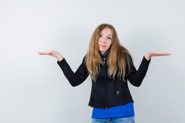 Expressive young woman posing in the studio