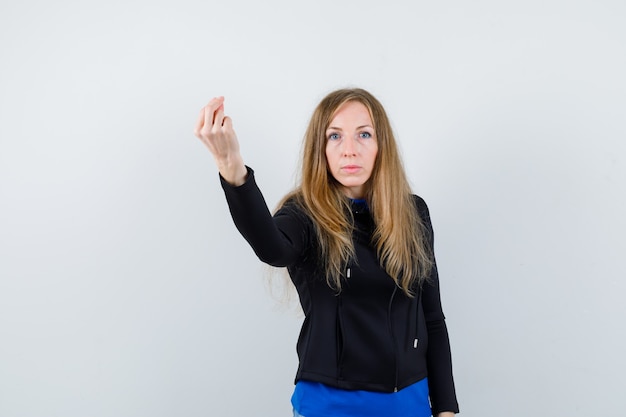 Expressive young woman posing in the studio