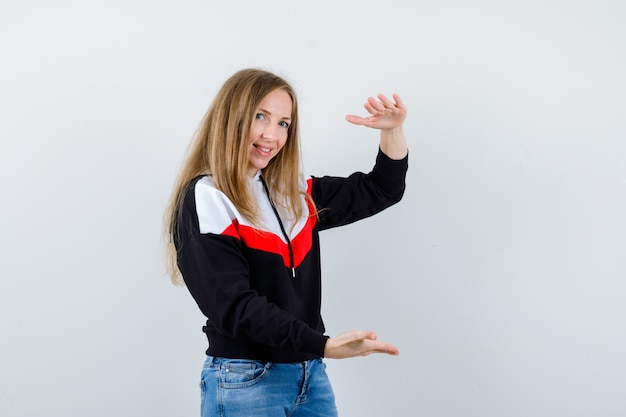 Expressive young woman posing in the studio