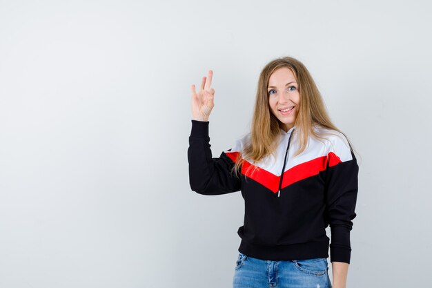 Expressive young woman posing in the studio