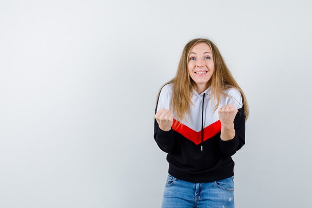 Expressive young woman posing in the studio