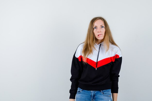 Expressive young woman posing in the studio