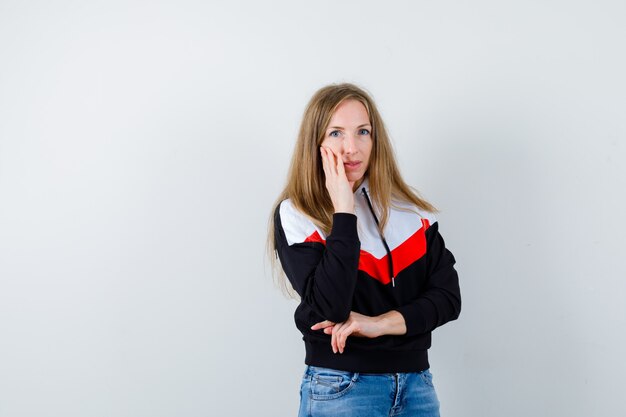 Expressive young woman posing in the studio