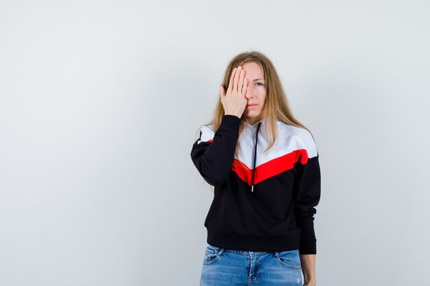 Expressive young woman posing in the studio