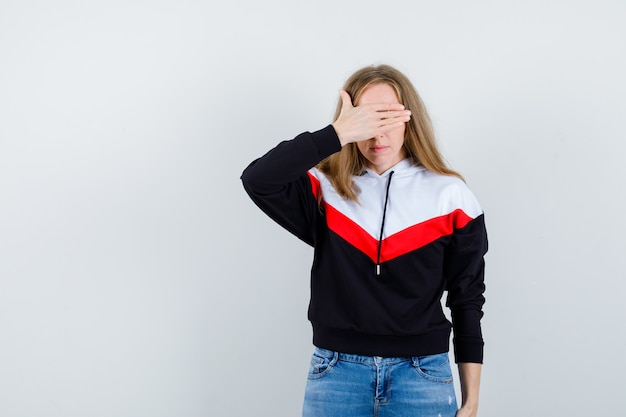 Expressive young woman posing in the studio