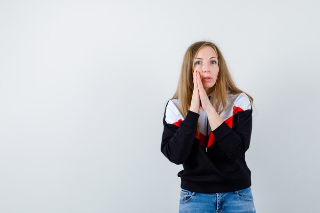 Expressive young woman posing in the studio