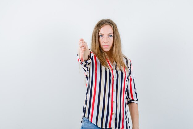 Expressive young woman posing in the studio