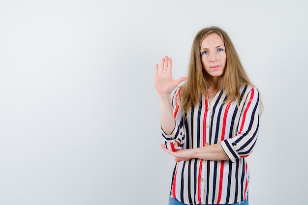 Expressive young woman posing in the studio