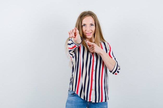 Expressive young woman posing in the studio