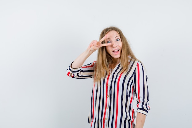 Expressive young woman posing in the studio