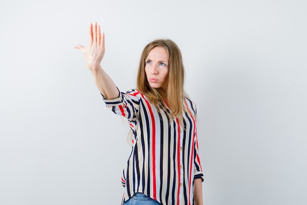 Expressive young woman posing in the studio