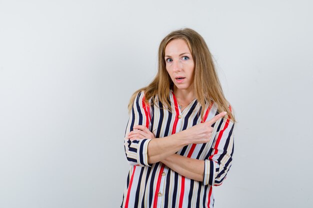 Expressive young woman posing in the studio