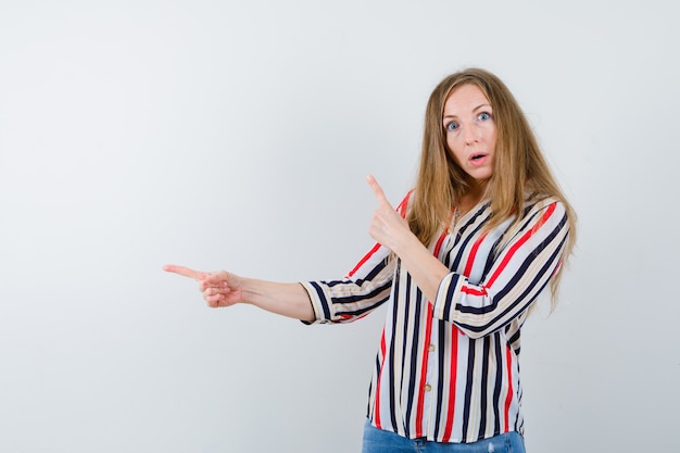 Expressive young woman posing in the studio