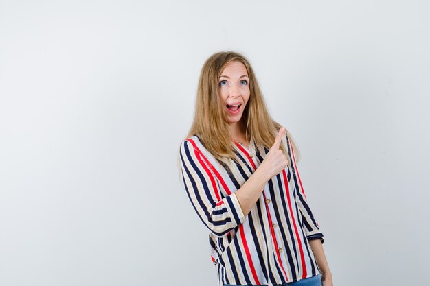 Expressive young woman posing in the studio