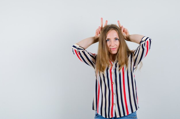 Expressive young woman posing in the studio