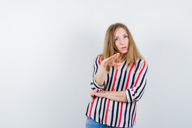 Expressive young woman posing in the studio