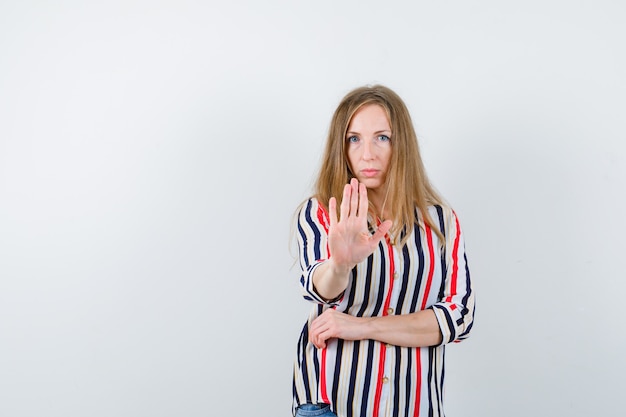 Expressive young woman posing in the studio