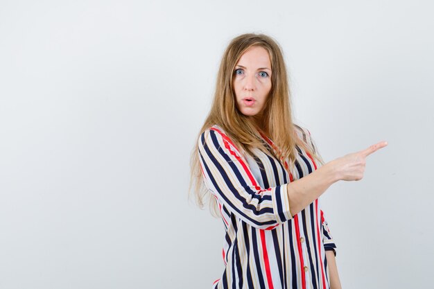 Expressive young woman posing in the studio