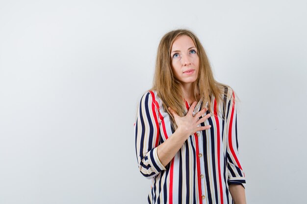 Expressive young woman posing in the studio