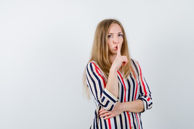 Expressive young woman posing in the studio