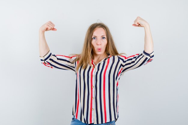 Expressive young woman posing in the studio