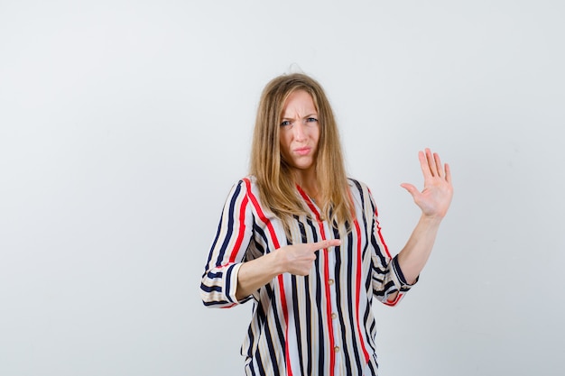 Expressive young woman posing in the studio