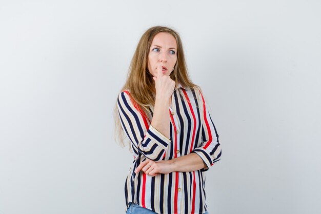 Expressive young woman posing in the studio