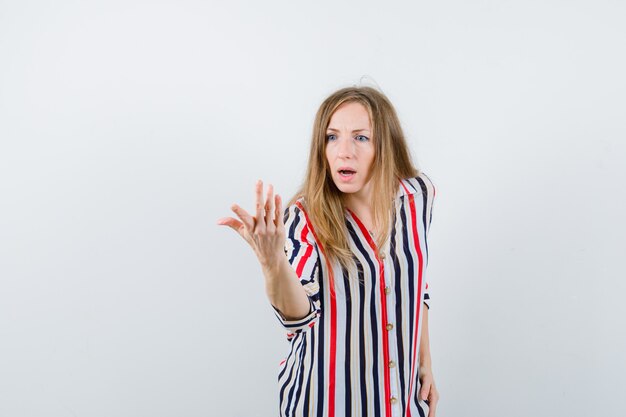 Expressive young woman posing in the studio