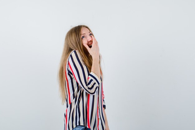 Expressive young woman posing in the studio