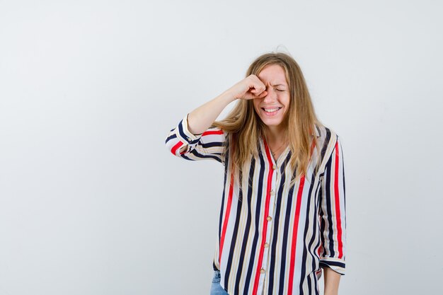 Expressive young woman posing in the studio