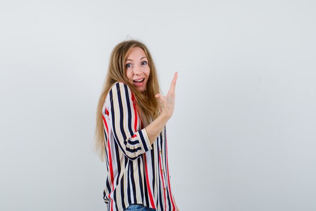 Expressive young woman posing in the studio