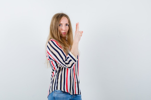 Expressive young woman posing in the studio