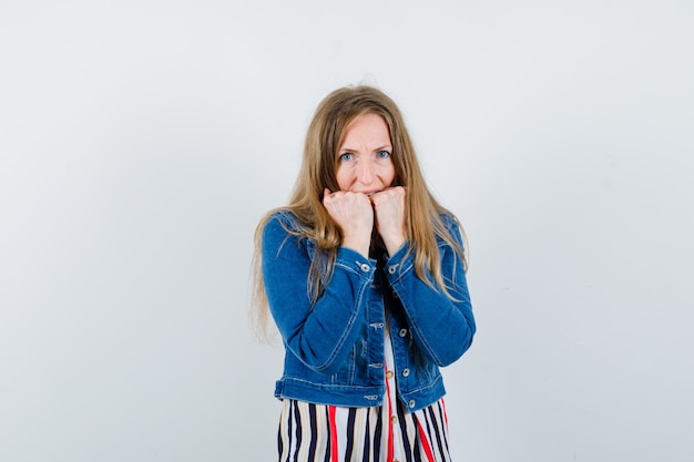 Expressive young woman posing in the studio