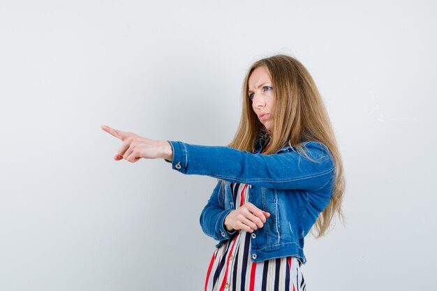 Expressive young woman posing in the studio