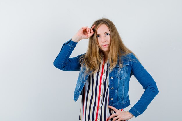 Expressive young woman posing in the studio