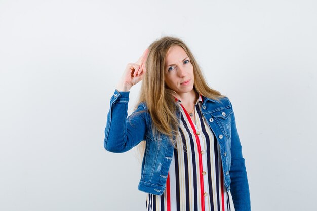 Expressive young woman posing in the studio