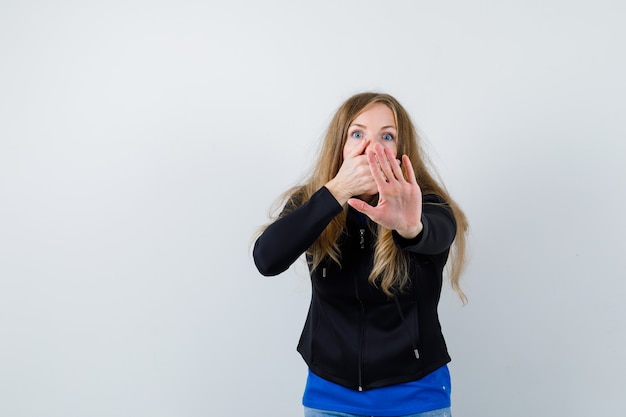 Expressive young woman posing in the studio