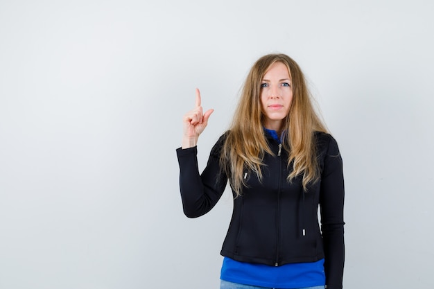 Expressive young woman posing in the studio