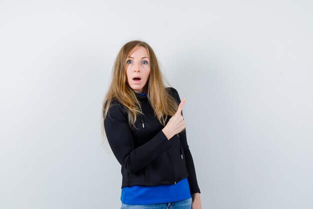 Expressive young woman posing in the studio