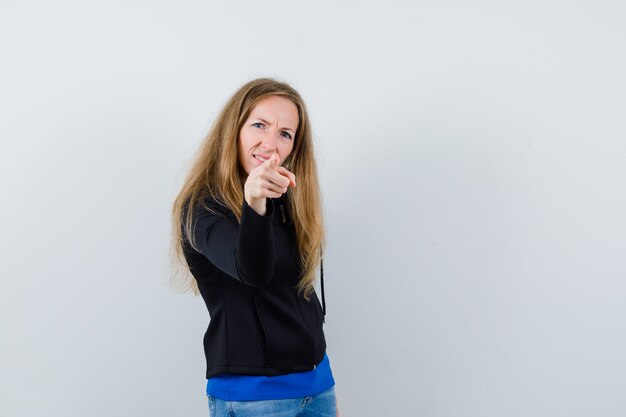 Expressive young woman posing in the studio