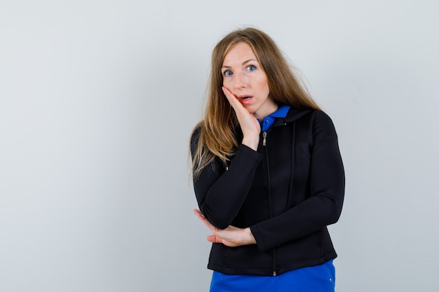 Expressive young woman posing in the studio