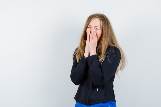 Expressive young woman posing in the studio