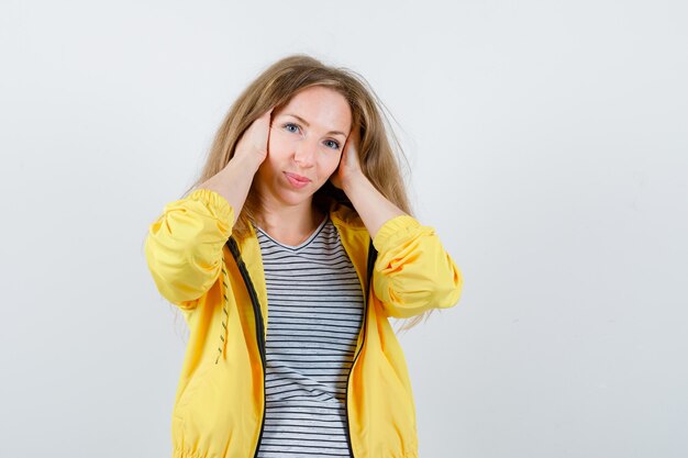 Expressive young woman posing in the studio